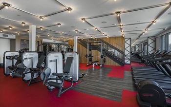 24-Hour fitness center with free weights, cardio machines and a multi-screen fit wall